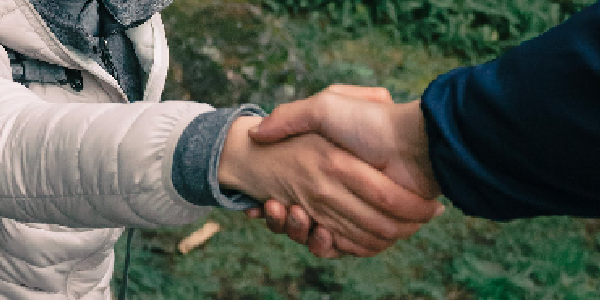 Two people handshaking