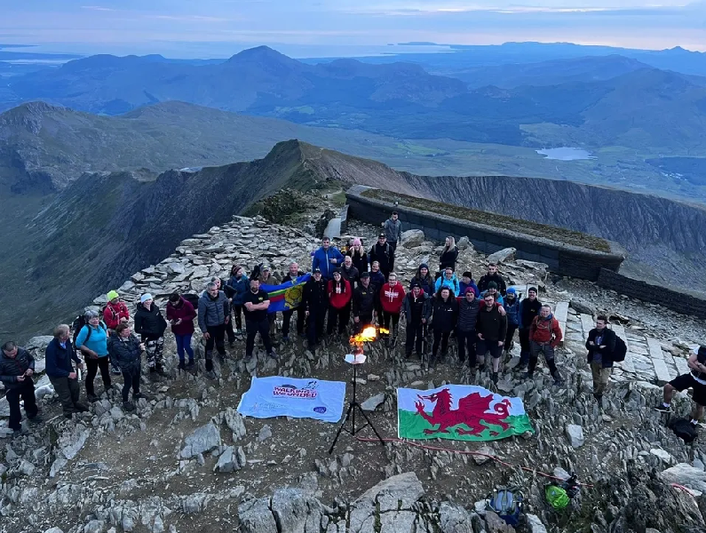Picture of a group posing on the top of Mount Snowdon
