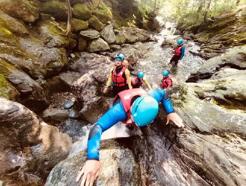 Image of people scrambling on rocks