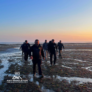 Leadership training in Washington DC, Dan Searson and Ant Middleton walking the foreshore with a team of senior executives as the sun sets.